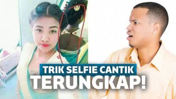 wanita sedang berselfi