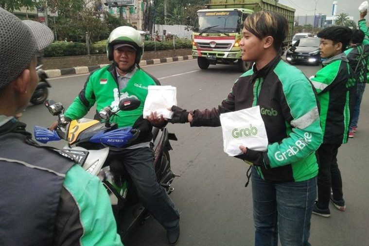 Ilustrasi ojek online berbagi