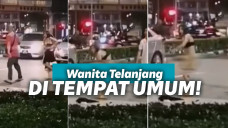 Wanita lepas pakaian di jalanan