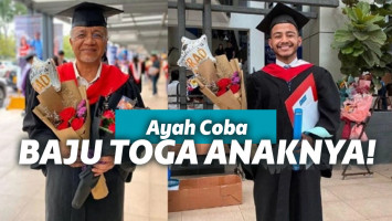 Ayah pakai baju wisuda anaknya