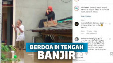 Berdoa di tengah banjir