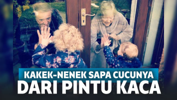 Wabah Corona, Kakek-Nenek Ini Sapa Cucunya dari Pintu Kaca