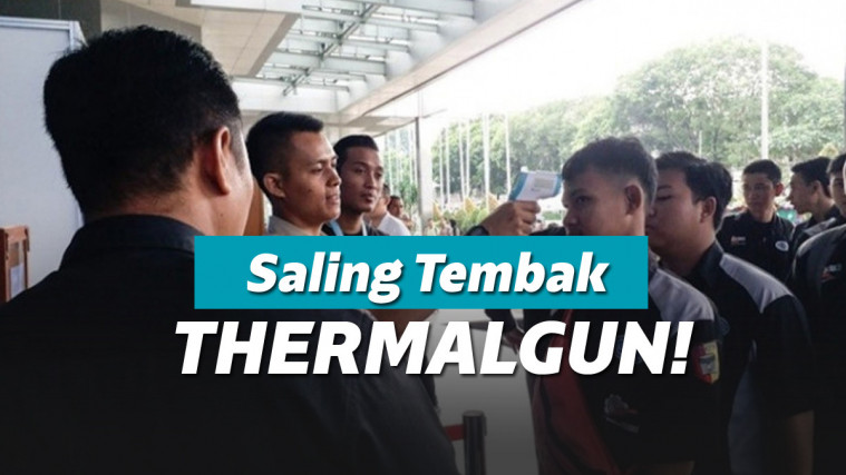 Ilustrasi mengecek suhu dengan thermal gun