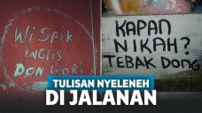 Tulisan nyeleneh di jalanan